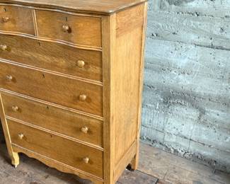 This lot features a stunning highboy dresser with a harp mirror with six (6) drawers and sitting on casters. This dresser measures with mirror, 65” H x 33.5” W x 18” D.