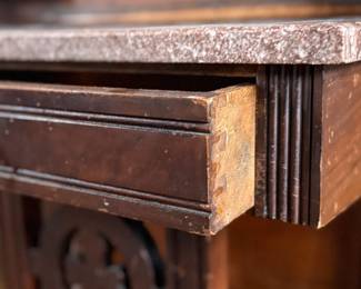This lot features a stunning late 19th century Eastlake Victorian hall tree with a marble top drawer, umbrella trays, and brass hooks. This piece measures, 84” H x 35” W x 12” D.
