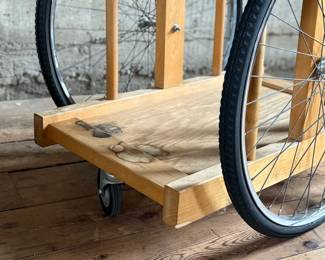 A whimsically designed Chopping Block Bar Cart by the noted California designer Bill W. Sanders. This design dates to the 1960’s. The bicycle tires may have been replaced at some point. The butcher block is in good condition. The bicycle wheels are a little wobbly when wheeled around but the cart is stable and sturdy. This cart measures, 29.5” H x 22” W x 34” D. A similar example is pictured in the book by the Pasadena Art Museum, California Design/Nine, Pasadena, 1965, Page 112.