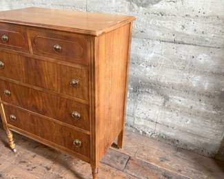 This lot features an antique highboy chest of drawers, crafted with solid wood and dove-tailed drawers. Two smaller drawers up top and three larger below. This dresser measures, 43” H x 34” W x 19.5” D.