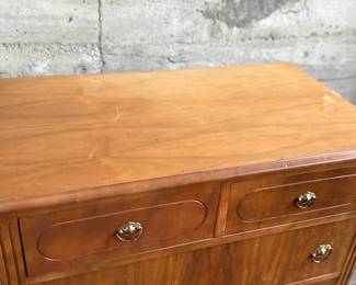 This lot features an antique highboy chest of drawers, crafted with solid wood and dove-tailed drawers. Two smaller drawers up top and three larger below. This dresser measures, 43” H x 34” W x 19.5” D.