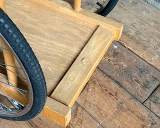 A whimsically designed Chopping Block Bar Cart by the noted California designer Bill W. Sanders. This design dates to the 1960’s. The bicycle tires may have been replaced at some point. The butcher block is in good condition. The bicycle wheels are a little wobbly when wheeled around but the cart is stable and sturdy. This cart measures, 29.5” H x 22” W x 34” D. A similar example is pictured in the book by the Pasadena Art Museum, California Design/Nine, Pasadena, 1965, Page 112.