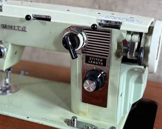 This lot features an antique sewing machine cabinet that is housing a White model 530 with a pedal as shown in photos. Comes untested, but appears to be in very good condition and measures (closed), 31.5” H x 27” W x 19” D.