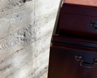 This lot features a Hardwick 4-drawer chest by Butler Speciality and a Reed & Barton utensil storage chest sitting on top. This piece measures (with top utensil box), 42” H x 18” W x 14” D.