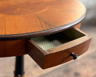 This lot features a 19th-century Biedermeier-style pedestal side table with a single drawer that measures, 20” H x 19” W x 13.5” D.