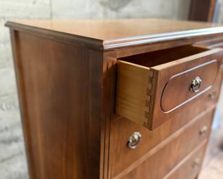 This lot features an antique highboy chest of drawers, crafted with solid wood and dove-tailed drawers. Two smaller drawers up top and three larger below. This dresser measures, 43” H x 34” W x 19.5” D.