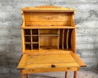 This lot features a plantation-style secretary desk with intricate details throughout that measures, 60.5” H x 36” W x 20.5” D.