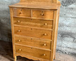 This lot features a stunning highboy dresser with a harp mirror with six (6) drawers and sitting on casters. This dresser measures with mirror, 65” H x 33.5” W x 18” D.