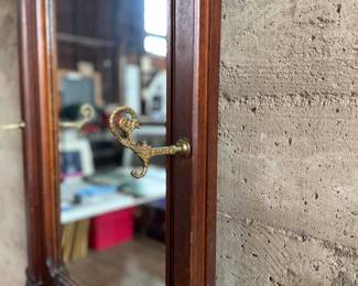 This lot features a stunning late 19th century Eastlake Victorian hall tree with a marble top drawer, umbrella trays, and brass hooks. This piece measures, 84” H x 35” W x 12” D.
