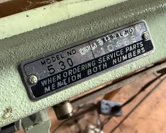 This lot features an antique sewing machine cabinet that is housing a White model 530 with a pedal as shown in photos. Comes untested, but appears to be in very good condition and measures (closed), 31.5” H x 27” W x 19” D.