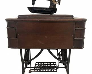 William Free No. Treadle Sewing Machine in Oak Cabinet