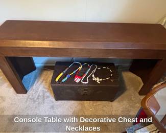 Console Table with Decorative Chest and Necklaces