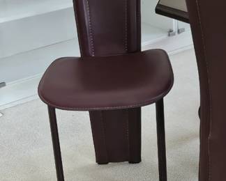 Eight Enrico Pellizonni leather chairs