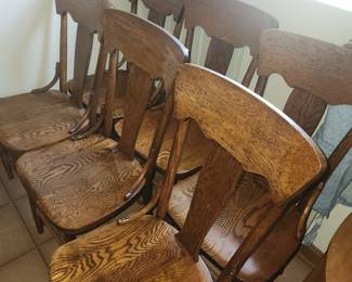 6 matching oak chairs looks they have been refinished