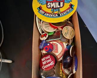 A collection of 1970 's and 80's buttons