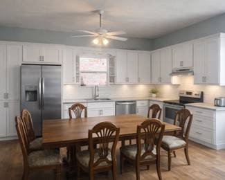 Dining table with custom pad cover. New fabric on seat seats.