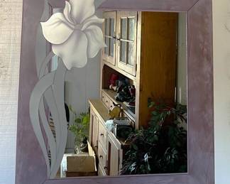 This particular wall mirror is showing a reflection of the kitchen hutch, but is otherwise a great accent to a room.