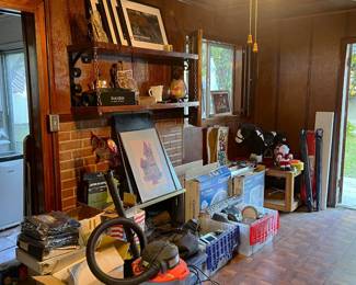 There is a wet/dry shop vacuum in the foreground, but this picture shows more miscellaneous household items you might like.