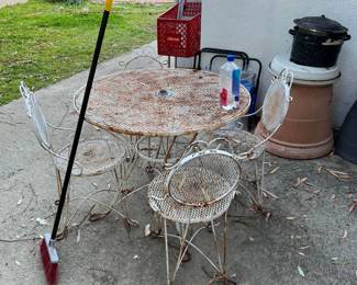 Okay, sure, this iron patio set needs a little work, but it's in good shape otherwise.