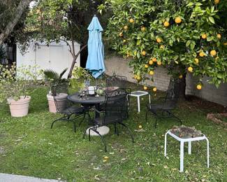 Here is another look at the patio table and chairs, plus a couple of small outdoor tables.  The shed is in the background.