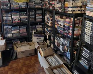 This picture shows the extent of the VHS tape collection, and much of the LP record collection.  Don't knock the VHS tapes, or claim you don't have a player...we have a solution.