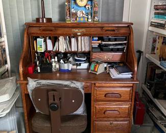 This is the small roll-top desk, and a classic office chair.  This works nicely also as a laptop station, but still keeps pens, pencils, staplers, scissors close.