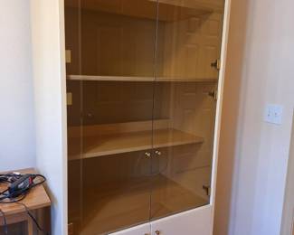 Beige enamel China cabinet, four shelves plus covered storage, glass front