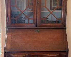 Vintage Chippendale style mahogany secretary desk and bookcase, glass paneled hutch, serpentine drawers, ball and claw feet