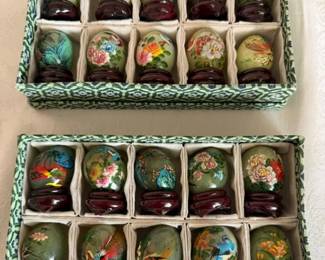 Miniature hand painted glass eggs on wood stands