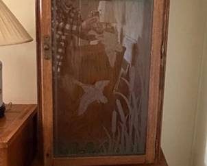 Gun cabinet with etched duck theme glass