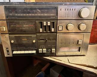 vintage JCPenney stereo system features an AM/FM tuner, 8-track player, cassette recorder, and a turntable