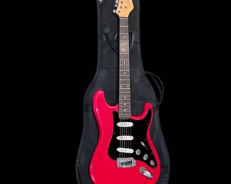 Red guitar in black gig bag
