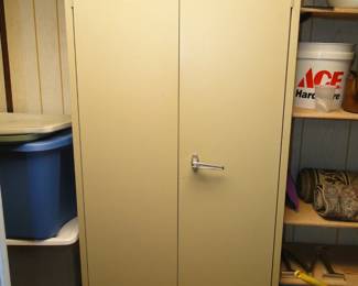 Metal storage locker, complete with key.