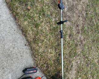 Newer string trimmer with spare battery and charger