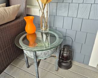 glass top table with iron pot base, sea glass inside