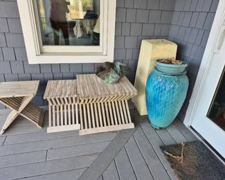 Teak tables and large glazed pottery urn