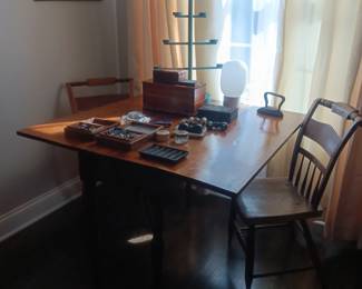primitive dining table and two chairs