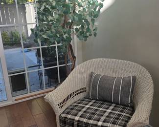 White wicker chair with padding