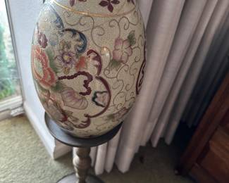 Ceramic vase on a stand