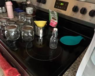 Assorted Mason Jars and Small Glass Bottles