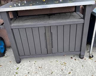 Outdoor table with storage 