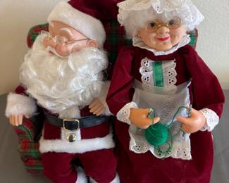 Mr. and Mrs. Claus Figures sitting on a couch