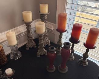 Ornate Metal Candlesticks and Red Vases