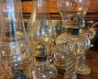 Collection of Antique Glass Oil Lamps, including Twisted Pedestal and Embossed Designs