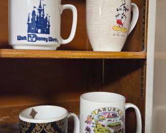 Collection of Four Souvenir Mugs: Disney, Mickey Mouse, Thailand, and Aruba