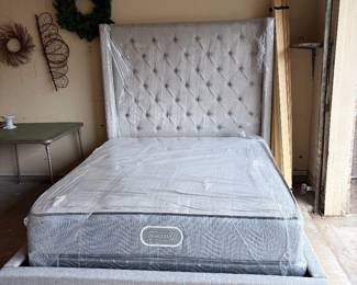 New.  Just removed from the box.  Mattress still wrapped in plastic.