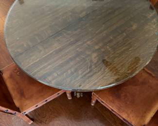 antique round oak dining table featuring carved lion's paw or claw feet 