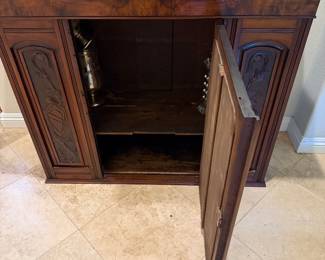 antique wooden fireplace mantel featuring a reddish-brown marble top and a centered mirror