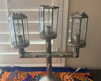 vintage-style electric candelabra table lamp featuring three glass-paned lantern shade