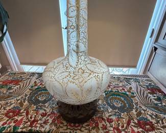 vintage table lamp features a white etched glass body